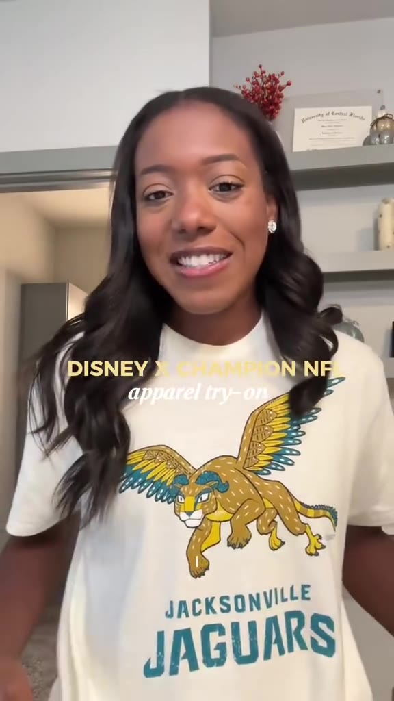 Maya wearing a cream Jacksonville Jaguars tee from the Disney x Champion collection